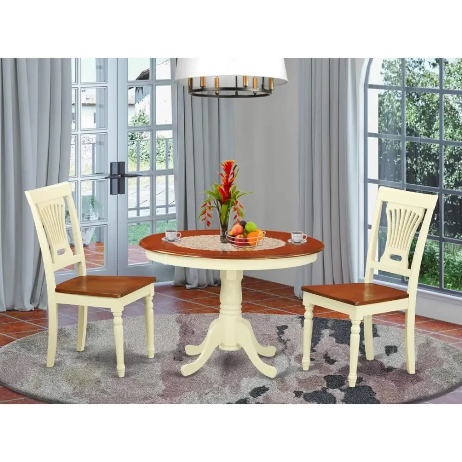 3 Pc set with a Round Dinette Table and 2 Wood Dinette Chairs in Buttermilk and Cherry .